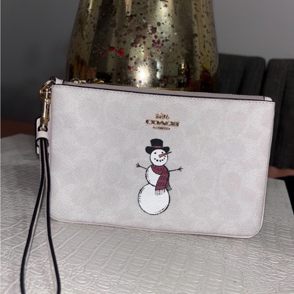 Coach Cream Wristlet with Snowman Motif